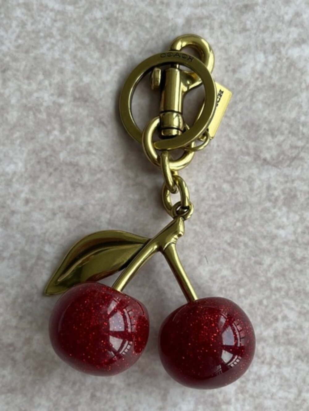 Coach Gold-Tone Cherry Key Charm with Red Glitter